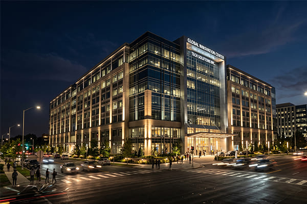 A large commercial building illuminated with floodlights